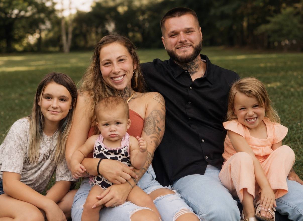 Hunter Sharbutt with his wife and three daughters