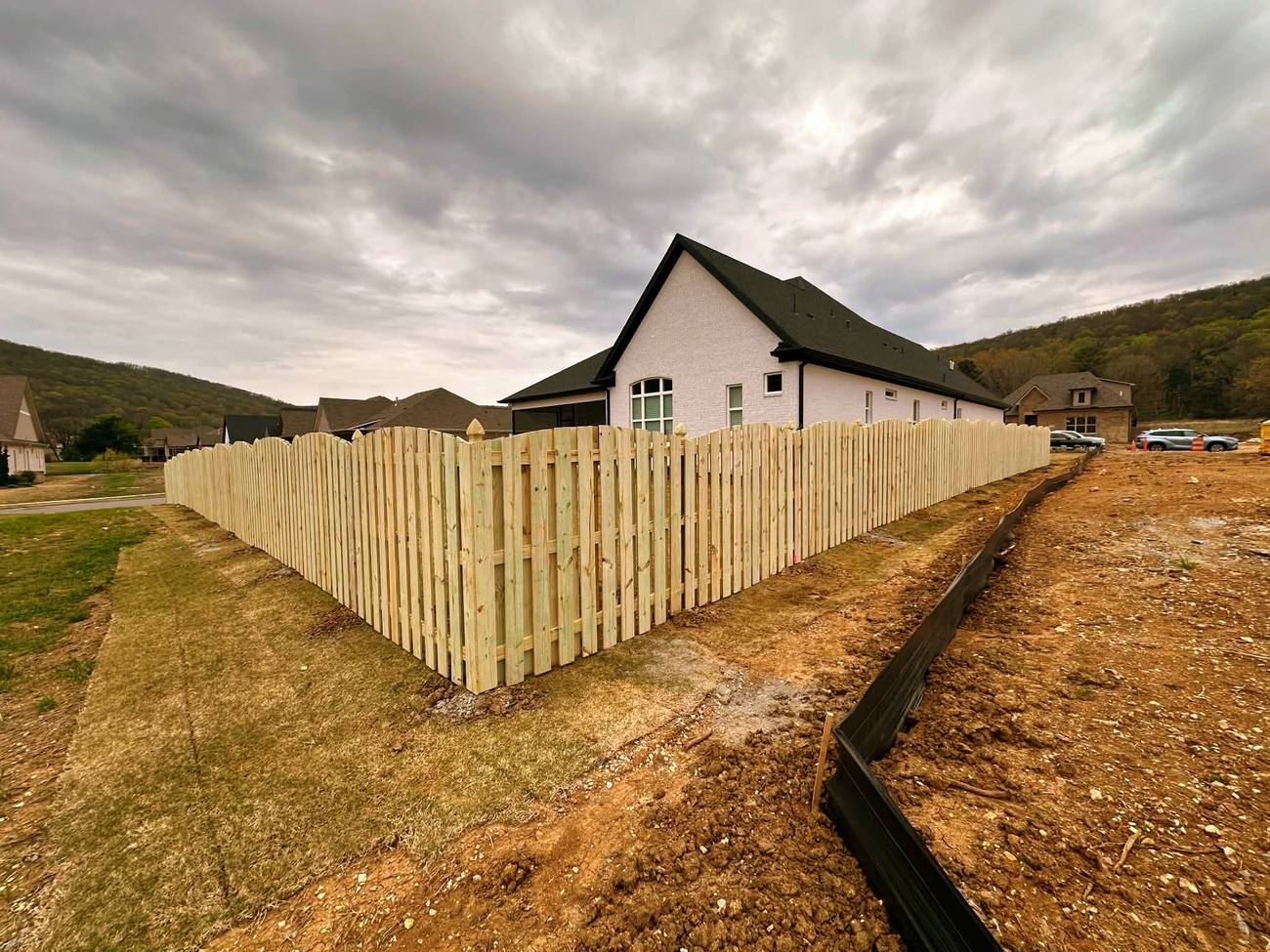 Shadow box wood fence with arched top