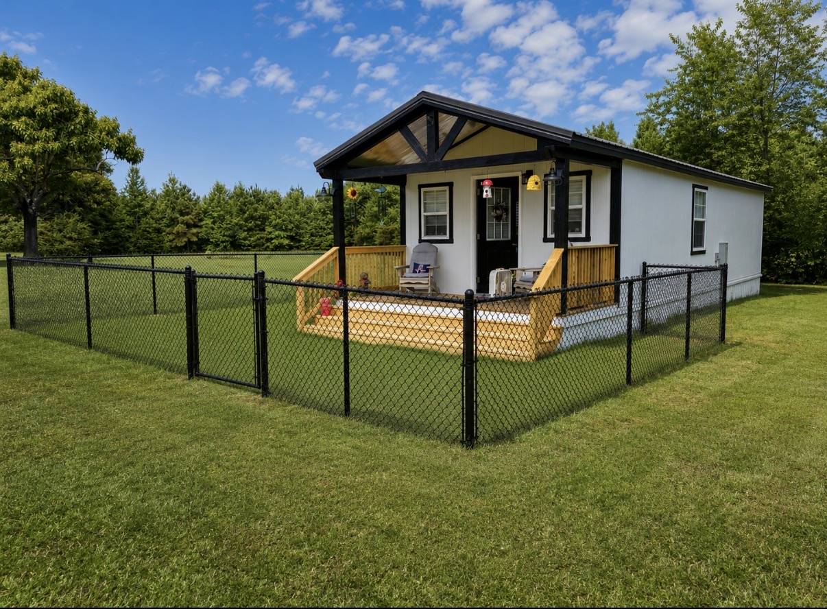 Black chain link fence around home
