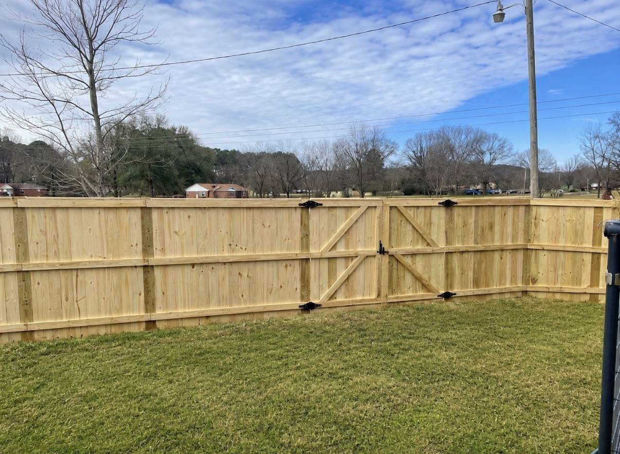 Wood privacy fence with double gate