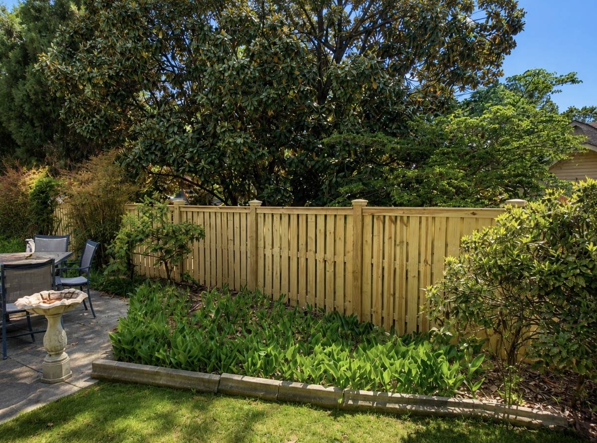 Wood privacy fence in backyard garden